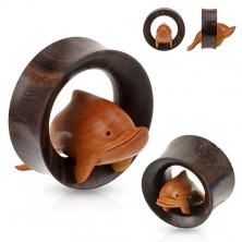Tunnel marrone all'orecchio di legno, delfino salta attraverso un cerchio