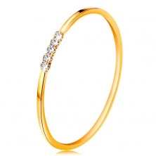 Anello realizzato in oro giallo 14K - linea di zirconi chiari, lati lucidi, sottili